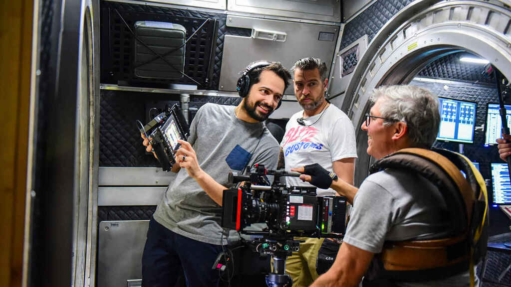 On the left is director Joe Pina while filming.